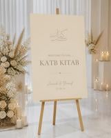 Minimal Beige Katb Kitab welcome board displayed on an easel