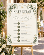 Sage Gold Katb Kitab Order of the Day displayed on an easel at a wedding venue