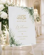White Botanical Katb Kitab welcome board displayed on an easel