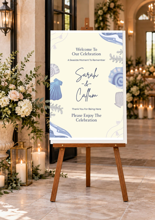 Beige and blue wedding welcome board on an easel indoors